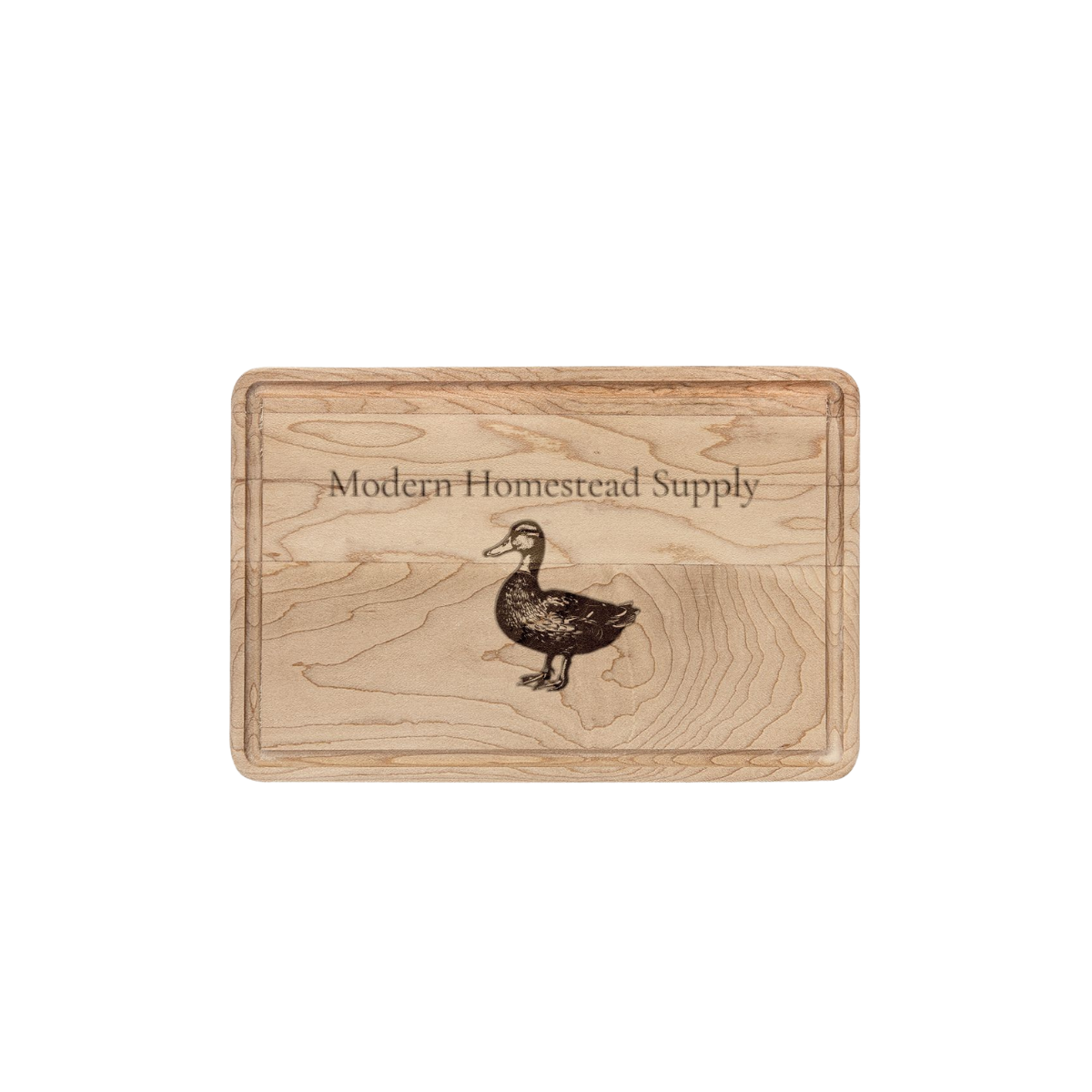 Wooden cutting board with 'Modern Homestead Supply' branding and duck illustration on a white background