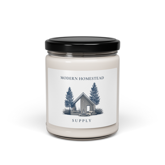 Candle jar with a label featuring a cabin and trees on a white background